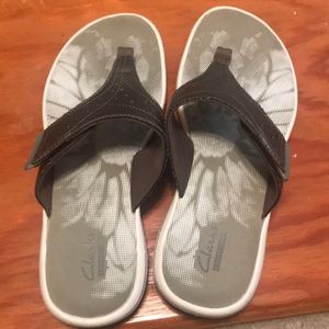 Clark’s bronze colored flip flops